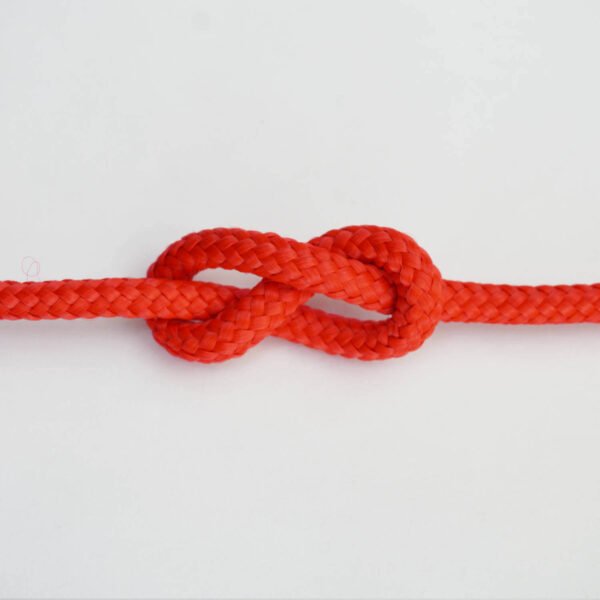 Detailed view of the 5mm Red Hot djembe rope, highlighting its strong polypropylene fibers.
